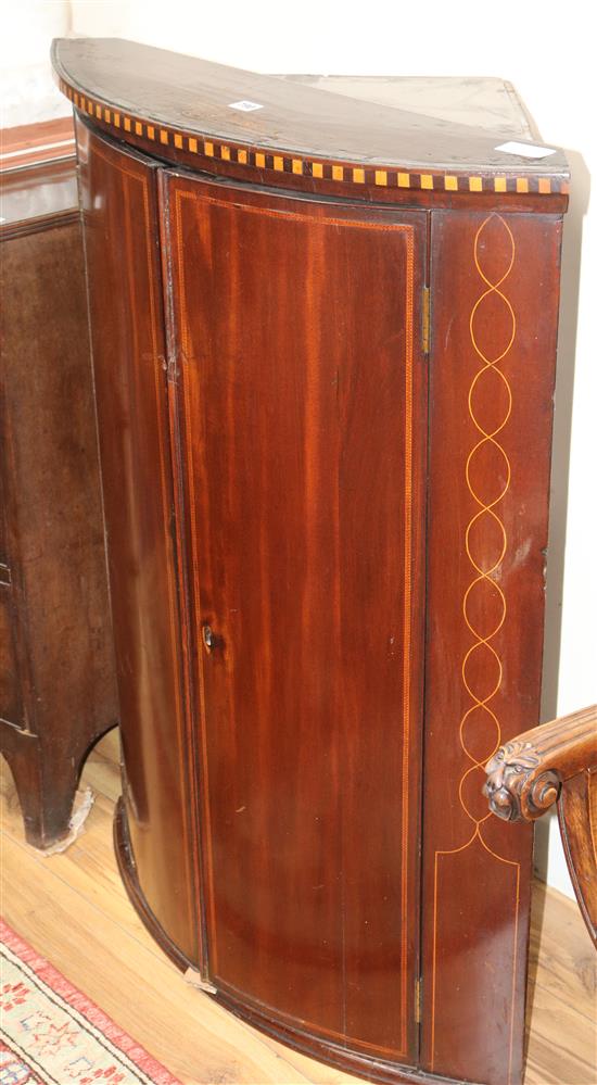 A George III inlaid mahogany bow front hanging corner cupboard W.80cm